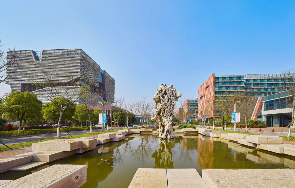 A water feature in front of two buildings at the main entrance to Xi’an Jiaotong-Liverpool University.
